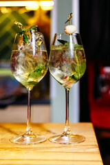 glass of mojito cocktail on table