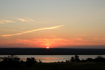 Picturesque view of beautiful sky over river at sunrise