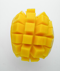 Half cube fresh mango on isolated whited background. Thai tropical fruit for dessert.