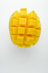 Half cube fresh mango on isolated whited background. Thai tropical fruit for dessert.