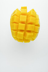 Half cube fresh mango on isolated whited background. Thai tropical fruit for dessert.