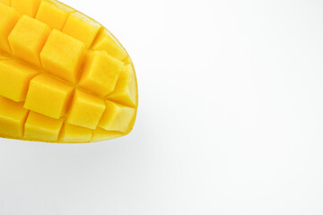 Fresh mango cut half and cube slice. Tropical fruit with isolated white background. Popular sweet dessert in Thailand.