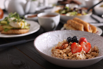 Oatmeal with fruits and nuts served on buffet table for brunch