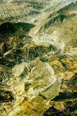 Aerial view of tall mountains and deserts over Iran
