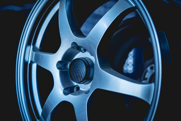 Car metal disc at the black background