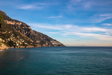Panoramic view from Fornillo Beach on the coastal towns Positano and Praiano at the Amalfi Coast, Italy, Campania, Europe. Vacation at the mountainous  and hilly coastline of the Mediterranean Sea