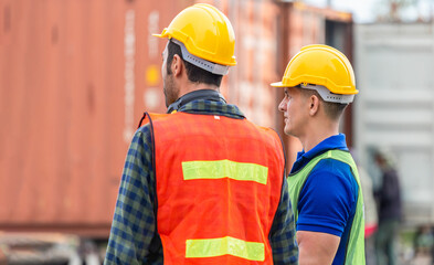 Supervisor and foreman worker team in the container yard, Industrial engineer and inspector or safety supervisor working in container terminal, Logistics concepts