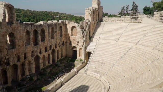Ancient theather in acropolis of Athens during sunny day.