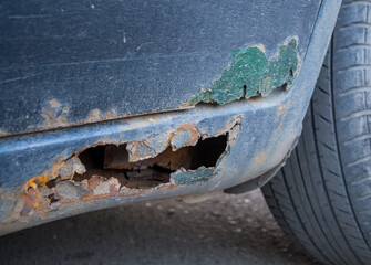 Decayed threshold and a fragment of a car door