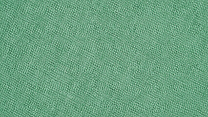 Green woven surface close-up. Linen texture. Fabric background. Textured braided wallpaper. Macro