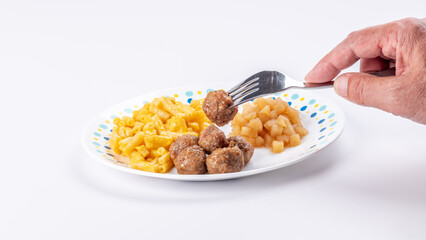 Close up of a children’s dinner with meatballs