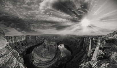 Fototapeta premium Horseshoe Bend panoramic aerial view, Arizona. Rocks and Colorado River at sunset in black and white.