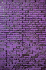 Fototapeta na wymiar Violet textured brick wall as background