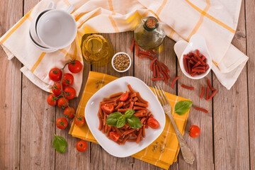 Lentil pasta with cherry tomatoes and basil.