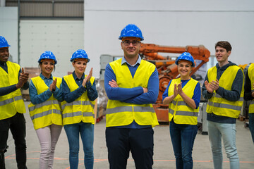 Group of workers applauding the promotion of their colleague