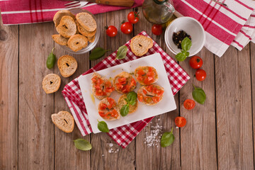 Friselle with cherry tomatoes and basil.