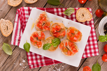 Friselle with cherry tomatoes and basil.