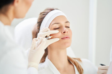 A scene of medical cosmetology treatments botox injection. - 503321972