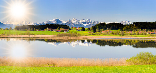 panoramic landscape with lake and mountain range
