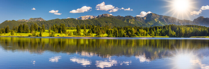 panoramic landscape with lake and mountain range