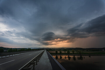 Dark storm clouds in the evening sky at the Danube in Bavaria, Germany