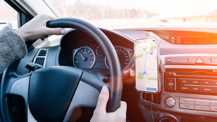 Gps car map system. Global positioning system on smartphone screen in auto car on travel road....