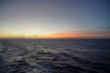 Obraz premium The magic of the ocean. Sunrise over the Atlantic. Horizon and endless space. Beautiful view. Clouds 