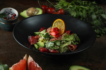 Tasty avocado salad with vegetables 