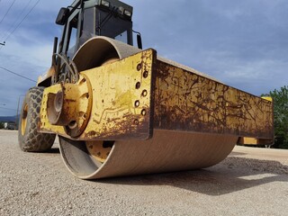 large old roller on gravel road