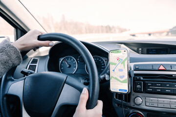 Gps car map system. Global positioning system on smartphone screen in auto car on travel road....