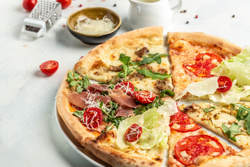 pizza set with different pieces of stuffing, slices of pizza margherita. Pizza margarita and hand close up. Food recipe background