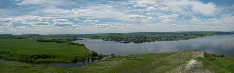 Sunny view on panorama of the Volga river. landscape with green hills and a river
