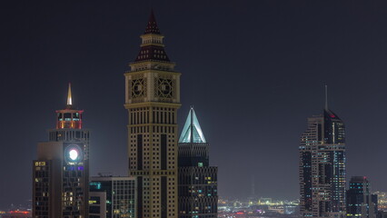 Fototapeta na wymiar Skyscrapers on Sheikh Zayed Road and DIFC night timelapse in Dubai, UAE.