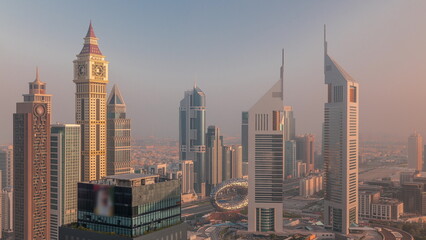 Fototapeta na wymiar Skyscrapers on Sheikh Zayed Road and DIFC morning timelapse in Dubai, UAE.