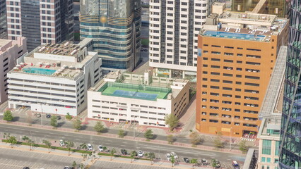 Rooftop swimming pool viewed from above timelapse, Aerial top view at financial district. People relaxing. Dubai, UAE