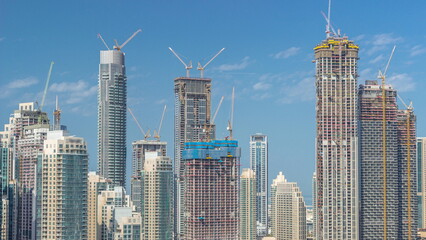 Fototapeta na wymiar Futuristic aerial cityscape timelapse with modern architecture of Dubai downtown, United Arab Emirates.