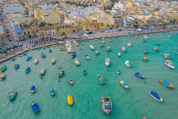 Aerial panoramic view of Marsaxlokk - small, traditional fishing village in the South Eastern...