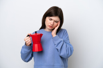 Young Russian woman holding coffee pot isolated on white background with headache