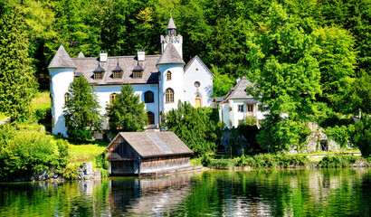 Fototapeta na wymiar Amazing beautiful town of Hallstatt in sumemr season, Austria. Homes over the lake.
