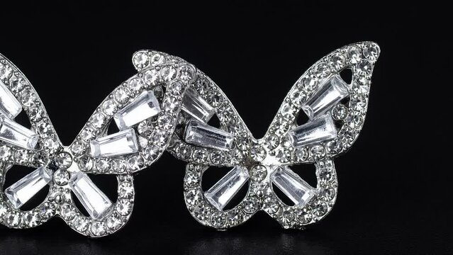 Diamond earrings jewelry, luxury silver and gold earrings with diamonds, sapphires in black background.