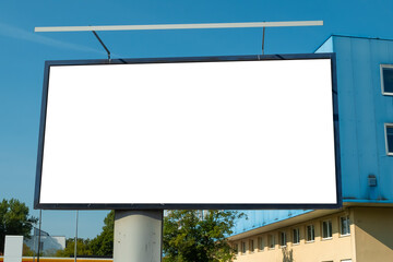 Advertising billboard mock-up in front of the office building on a sunny day