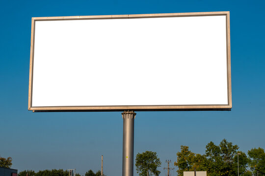 Advertising billboard mock-up in the city on a sunny summer day