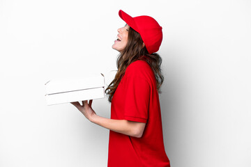 Pizza delivery woman with work uniform picking up pizza boxes isolated on white background laughing in lateral position