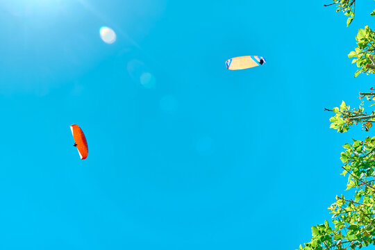 Paragliding. Two paraplane flying in clear blue. Sport extreme.