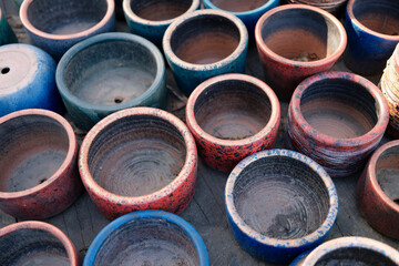 Old clay pots flowerpots closeup. Various used ceramic and clay pots