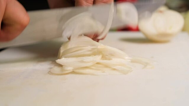 chef chopping onions 