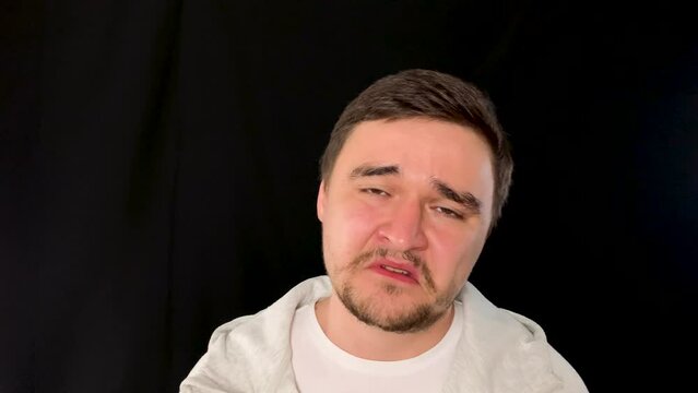 Causasian man holding back tears after receiving devastating soul-crushing news 
