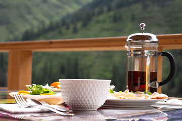 Breakfast in the early morning outdoors in a country house