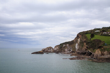 Sea shore with rocks. Cloudy skies, storm approaching