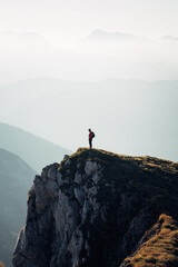 Person standing on top of a mountain